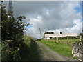 Traditional cottage in the shadow of a transmission mast