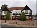 Former factory, former bus garage, boarded up