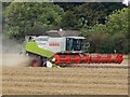 SU1078 : Combine harvester, north of Broad Hinton, Wiltshire by Brian Robert Marshall