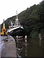 The Fishing Boat Rebecca eases up the Eye Water to the Boatyard for a Refit