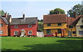 Bright cottages lining the green at Hartest