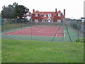 Tennis court and Dunes Cottage behind