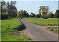 Lane crossing open ground west of Shelland